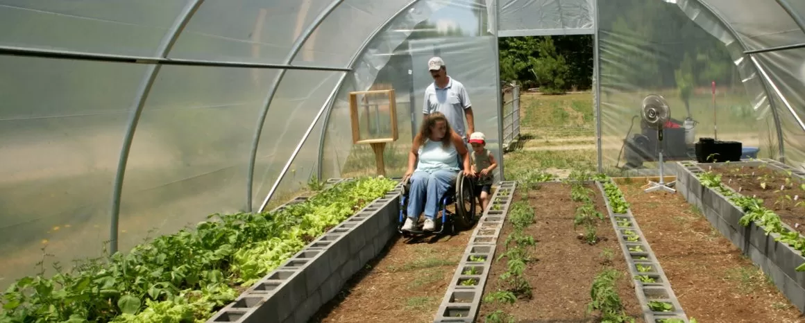 Family exploring a greenhouse